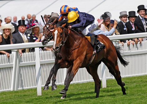 Hillstar (yellow cap) wins the King Edward VII Stakes with Battle of Marengo (obscured) on June 21, 2013.
